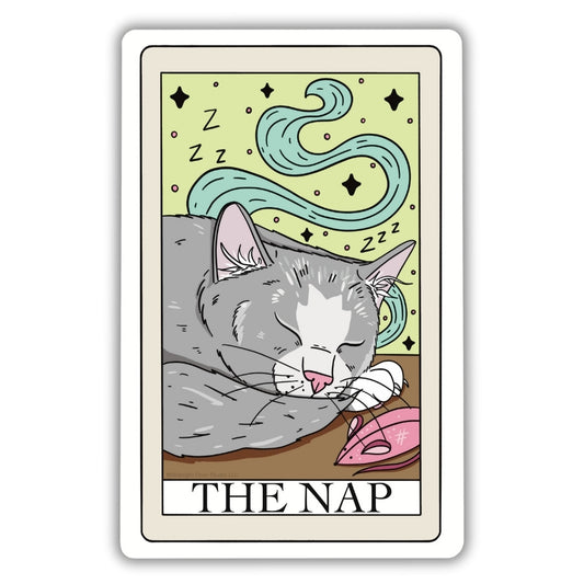 The Nap Tarot Card Vinyl Sticker. A gray cat with a white patch on its forehead and a pink nose sleeping in front of a green background and “zzz”’s floating in the air. There is a pink mouse cat toy laying next to the gray sleeping cat.
