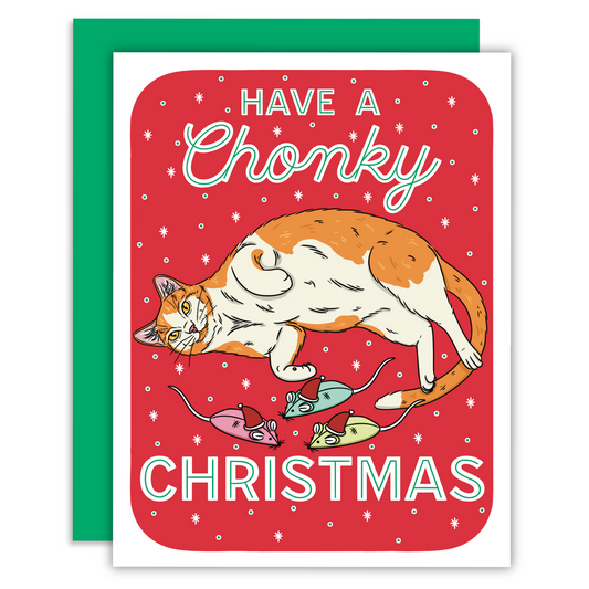 An orange and white chonky cat laying down with three small mouse cat toys on a red background with decorative text that says have a chonky christmas.