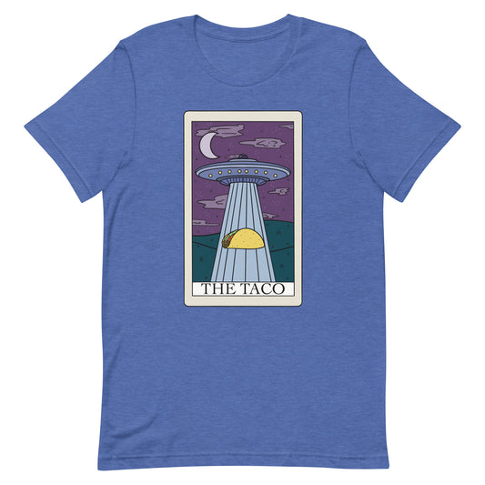 The taco tarot card t-shirt in heather true royal. A ufo sucking up a taco on a tarot card with text the taco. Keywords: tarot card shirt, funny tarot card, taco lover gift, taco shirt, shirt for taco lover, ufo t-shirt, trippy shirts